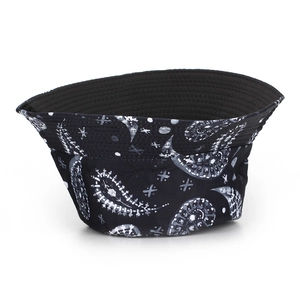 Black bucket hat with white paisley and star patterns shown from a top-down side view