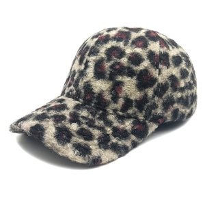 Detailed macro view of the warm leopard print leopard grain lamb wool baseball cap texture