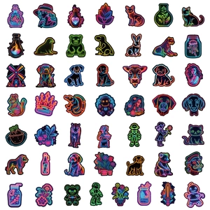 Flat lay of diverse neon style graffiti stickers featuring animals and fantasy motifs