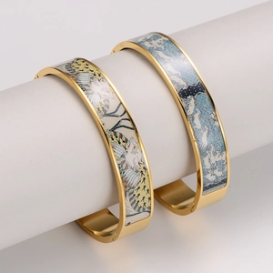 Elegant gold-plated stainless steel hinged bangles with animal enamel art patterns