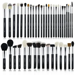 Macro view of professional 32-piece black and silver makeup brush set with assorted soft heads
