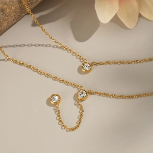 Elegant gold stainless steel Y-shaped necklace with dangling cubic zirconia stones
