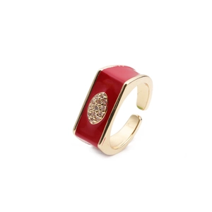 Adjustable gold ring with red enamel and inlaid zircon shown at 45-degree angle