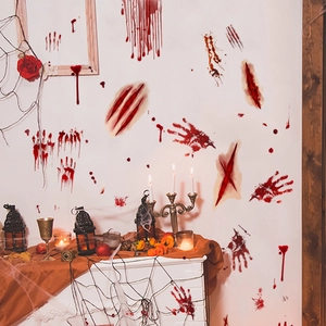 Spooky Halloween wall stickers with bloody handprints and footprints on a white wall