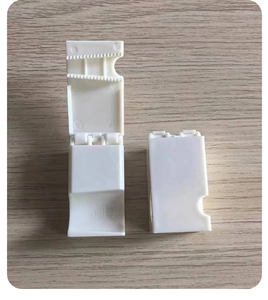 Detail view of the durable white plastic hinges and structural fasteners for shellers