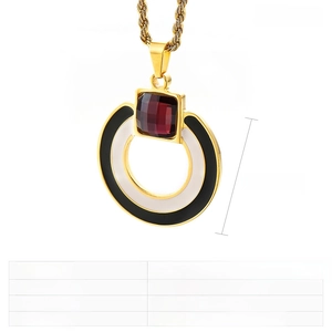 Detail view of 38mm stainless steel geometric pendant with red crystal and black drip glue