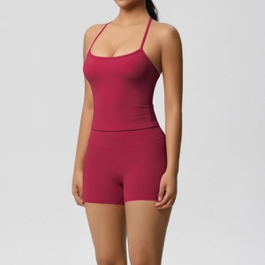 Detail of high-stretch burgundy yoga set featuring a camisole top and high-waist shorts