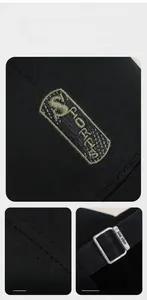 Detail of adjustable metal buckle and embroidered SPORTS patch on black cotton baseball cap