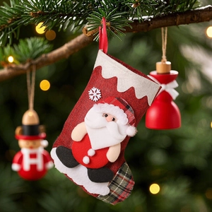 Linen Christmas stocking with 3D Santa Claus doll hanging on a festive decorated tree