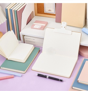 Assorted A6 mini notebooks with lined and grid pages in pastel colors and pens