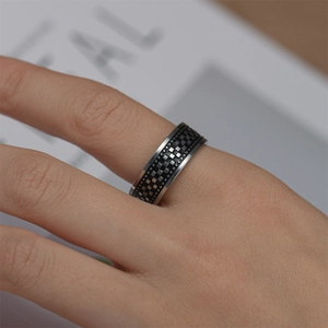 Men's vintage titanium steel ring with black and silver checkered pattern on fingers