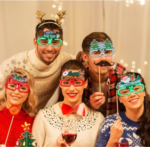 Group of friends wearing LED glowing Christmas party glasses with glitter festive designs