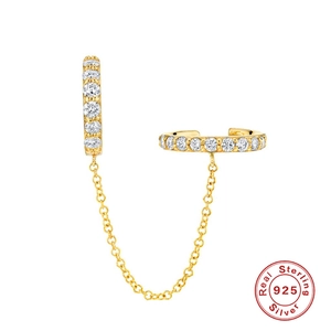 Detail of 925 sterling silver chain earring with zircon inlay and 18K gold finish