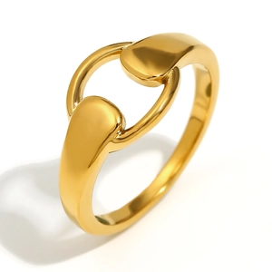Polished 18K gold plated horsebit interlocking ring with a modern minimalist aesthetic