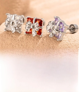 Detail of silver bow cubic zirconia stud earring showing 0.8x6mm titanium steel bar size
