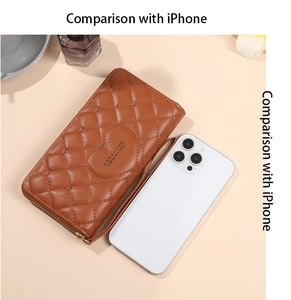 Brown heart-quilted long wallet shown next to an iPhone for size comparison