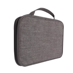 Detailed view of the gray fabric watch strap storage bag with a sturdy carry handle
