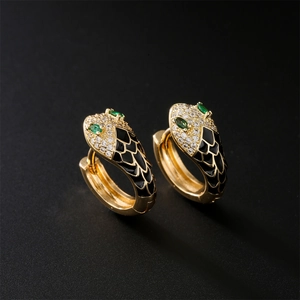 Golden snake hoop earrings with clear crystals, green gem eyes and black enamel scales