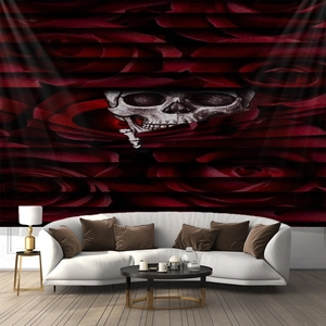 Detail of gothic tapestry featuring red roses and a skull over a white sofa