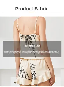 Detail view of the champagne silk satin texture and abstract plant patterns on the pajama set
