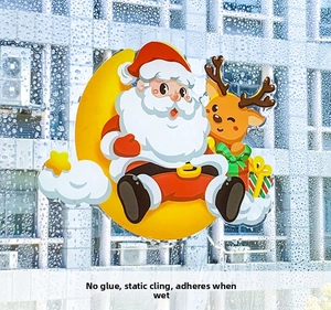 Detail of Christmas window stickers showing glueless static cling Santa on glass