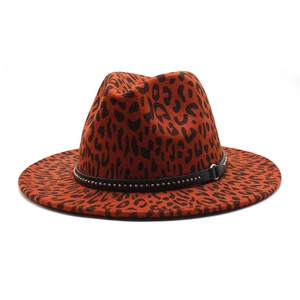 Detail of leopard print fedora hat featuring black leather band with golden metal studs