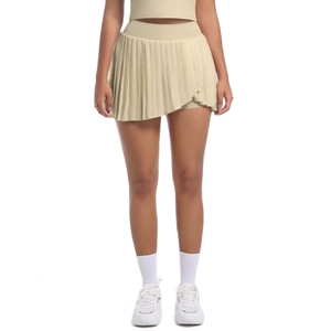 Front detail of pleated tennis skirt with irregular hem and moisture-wicking fabric