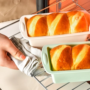 Rectangular silicone toast pans for home baking, cream and green bread molds in oven