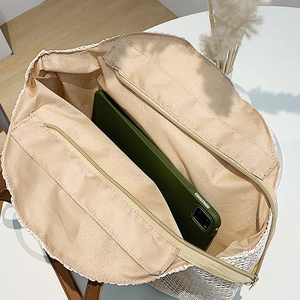Straw tote bag internal structure with dual zip pockets and spacious storage space