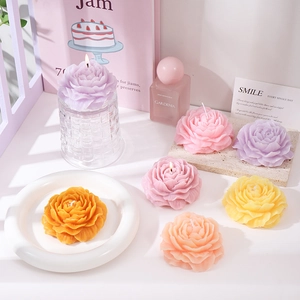 Handcrafted peony flower scented candles in various colors for elegant home decor and gifts