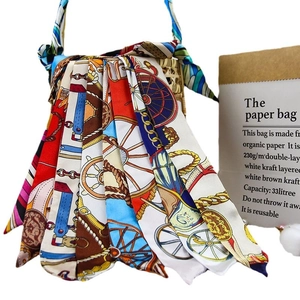 Woven basket tote bag decorated with colorful equestrian print silk scarves and ribbons