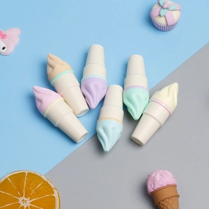 Set of pastel ice cream shaped highlighters in macaron colors on blue gray background