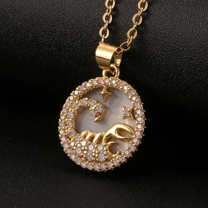Golden Scorpio constellation pendant necklace with mother of pearl and inlaid crystals