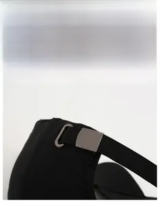 Detail of adjustable metal buckle and strap on the black casual baseball cap for men