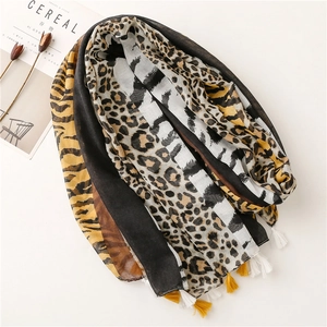Leopard and tiger print cotton linen scarf with tassels on minimalist white background