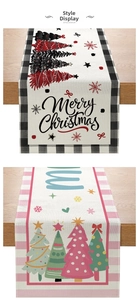 Detail of Christmas table runners with plaid and striped borders on wood surface
