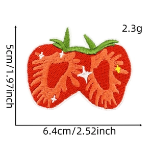 Detail of red strawberry embroidery patch showing 6.4x5cm dimensions on white background
