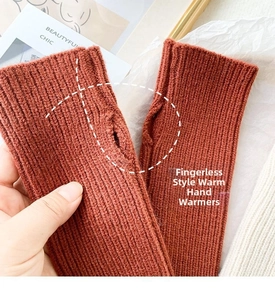 Detailed close-up of terracotta knitted fingerless gloves with elastic ribbed texture