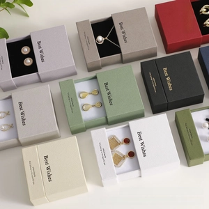 Detail of drawer jewelry boxes showing premium lychee leather texture and multiple colors