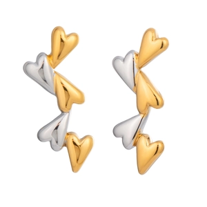 Detail of linked heart earrings in alternating gold and silver metallic tones