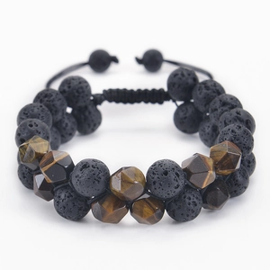 Detail of 10mm matte tiger eye and lava stone beads on a double-layer braided bracelet