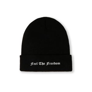 Close-up of Feel The Freedom white embroidery on a black ribbed knit beanie hat
