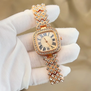 Macro shot of luxury gold square watch with full crystal inlay and Roman numerals