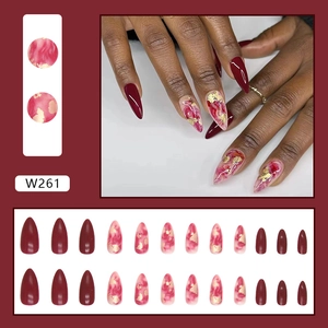 Almond press-on nails set featuring burgundy red and gold foil marble design