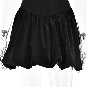 Detailed view of backless black bubble dress with square neck and satin-like finish