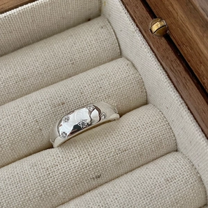 Polished S925 sterling silver star ring with inlaid cubic zirconia in a jewelry box