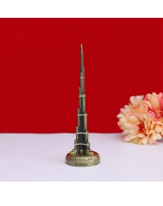 Detailed close-up of bronze Burj Khalifa souvenir with sparkling rhinestone accents