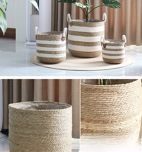 Close-up of handwoven seagrass planters with leather tabs and waterproof lining details