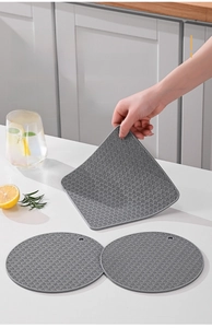 Three-dimensional wavy texture on grey silicone heat resistant mat for kitchen counters