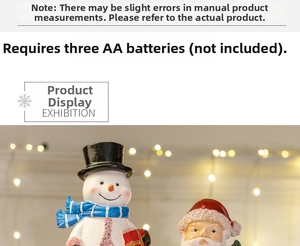 Detail of Christmas lantern snow globe showing Santa and snowman with internal lighting